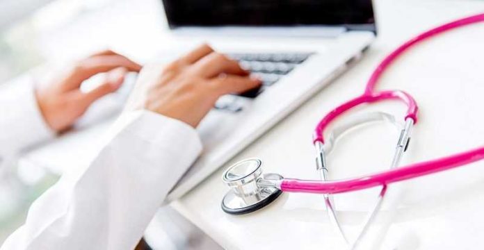 Doctor working on a laptop